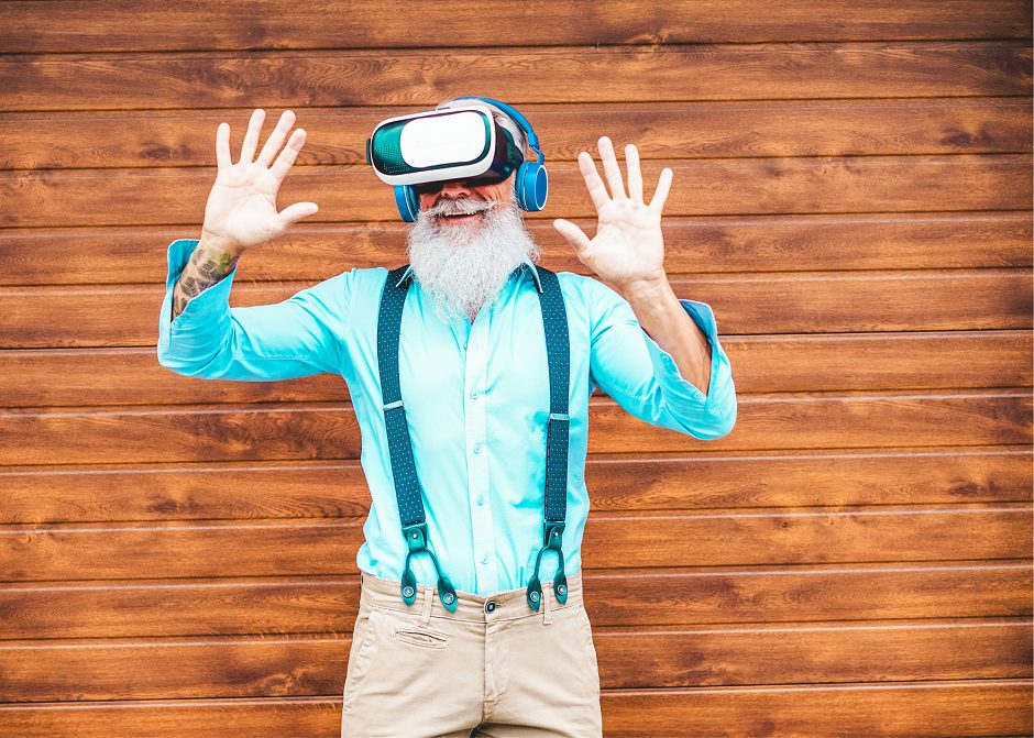 senior man with virtual reality headset in front of brick wall