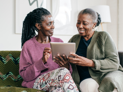 An African American woman and her sister exploring assisted living options for their parent