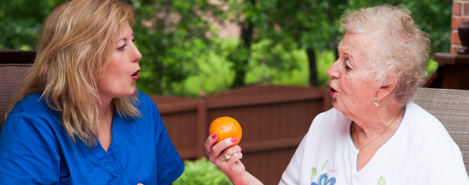 Senior woman with speech therapist
