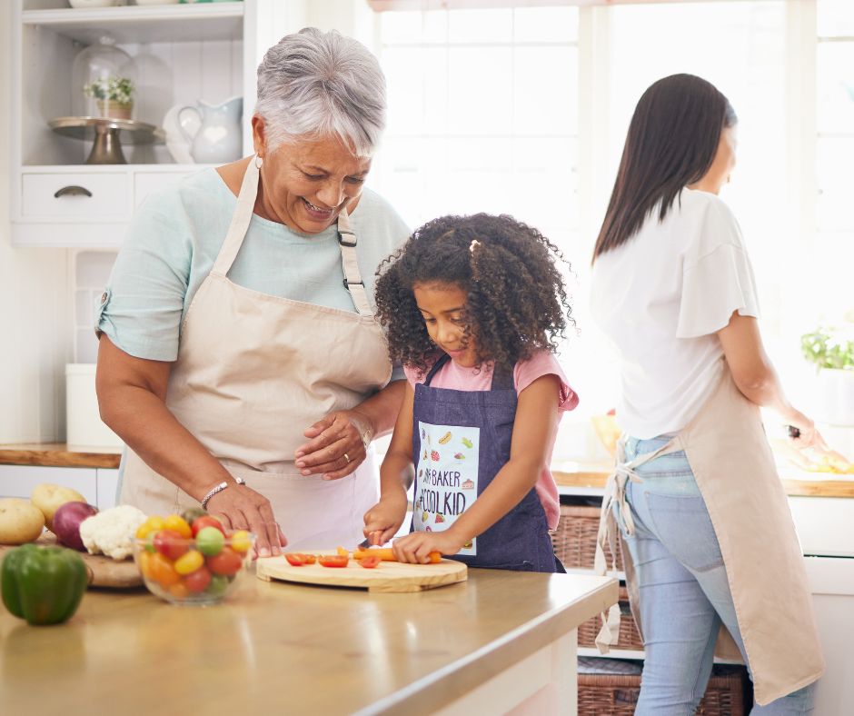a grandparent baking with her granddaughter