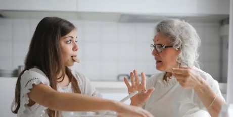 grandmother and granddaughter baking