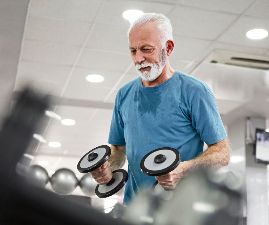 Senior man using free weights