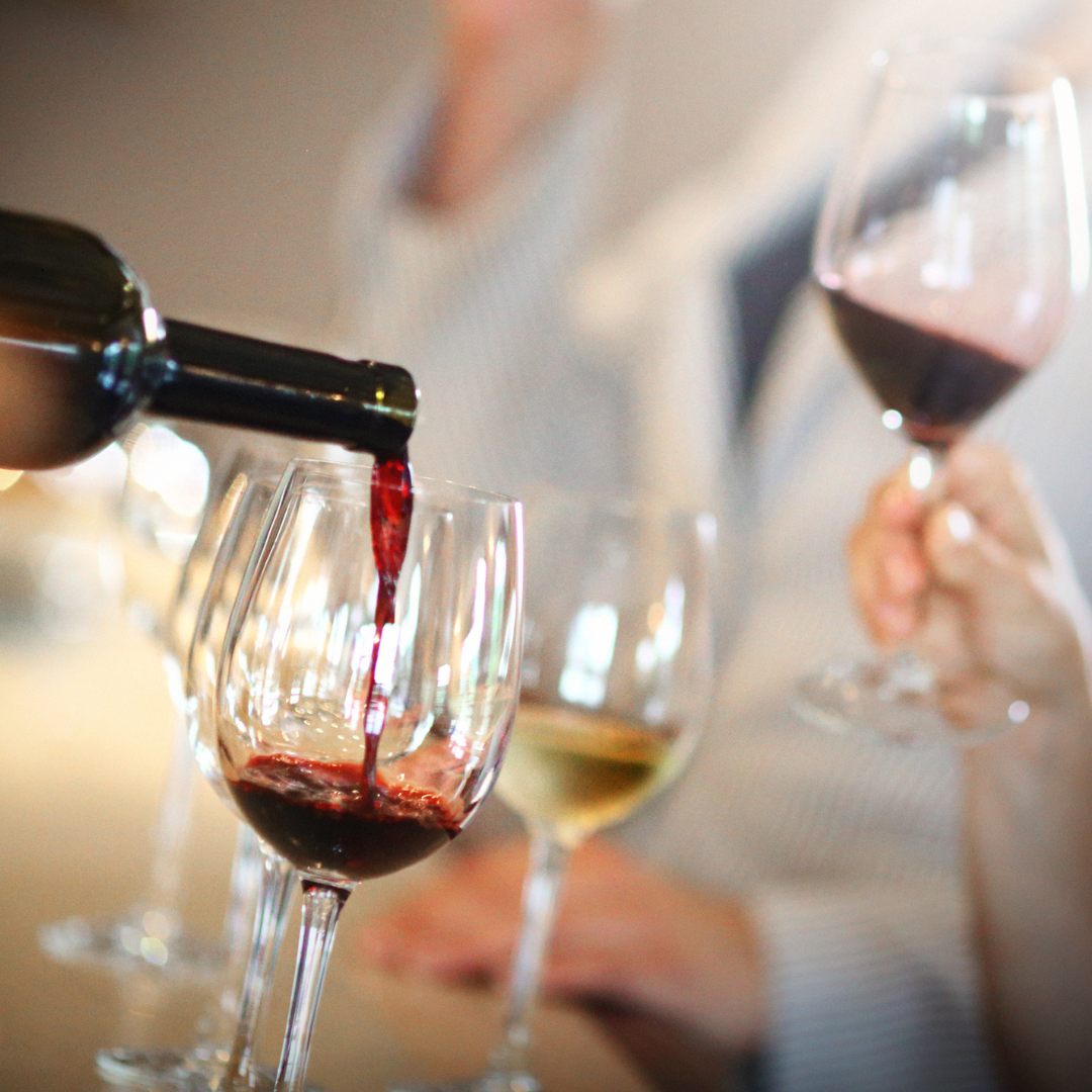 Pouring white and red wine