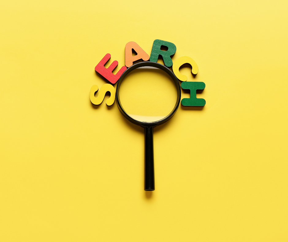 magnifying glass on yellow background with word search spelled in blocks above