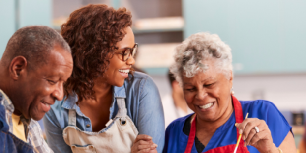 Older adults in art class with instructor