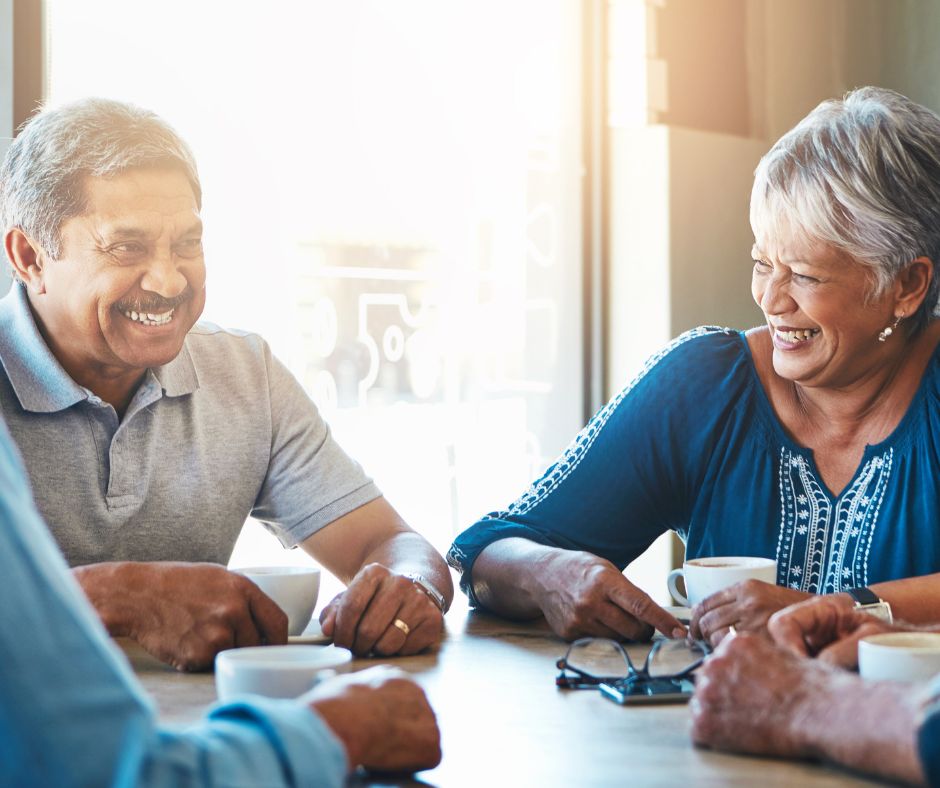 older adults sitting around a table