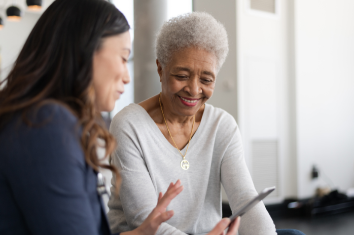 Black senior woman with nurse