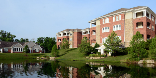 exterior of Twin Lakes community with lake