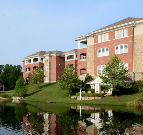 exterior of Twin Lakes community with lake front view