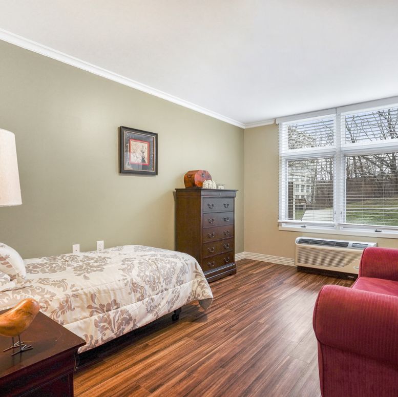 bedroom of memory care apartment at Wesley Glen