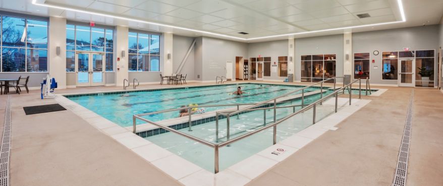 Harcum Fitness and Aquatic Center pool with members swimming