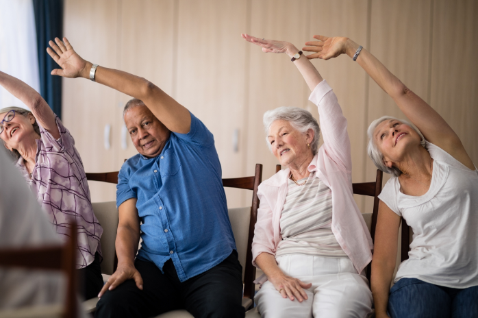 Seniors stretching during a chair exercise class