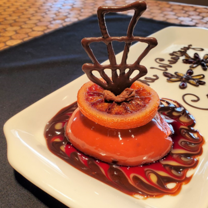 Upscale orange fruit dessert made by Wesley Woods chef. Delicious dining options with senior living in New Albany.
