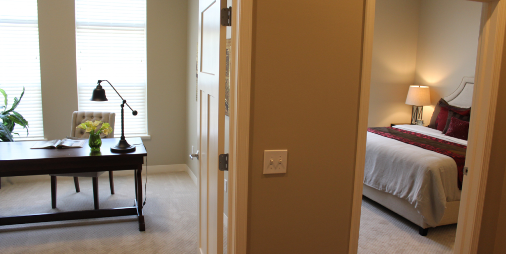 Interior of Wesley Woods two-bedroom senior independent living apartment showcasing den and bedroom