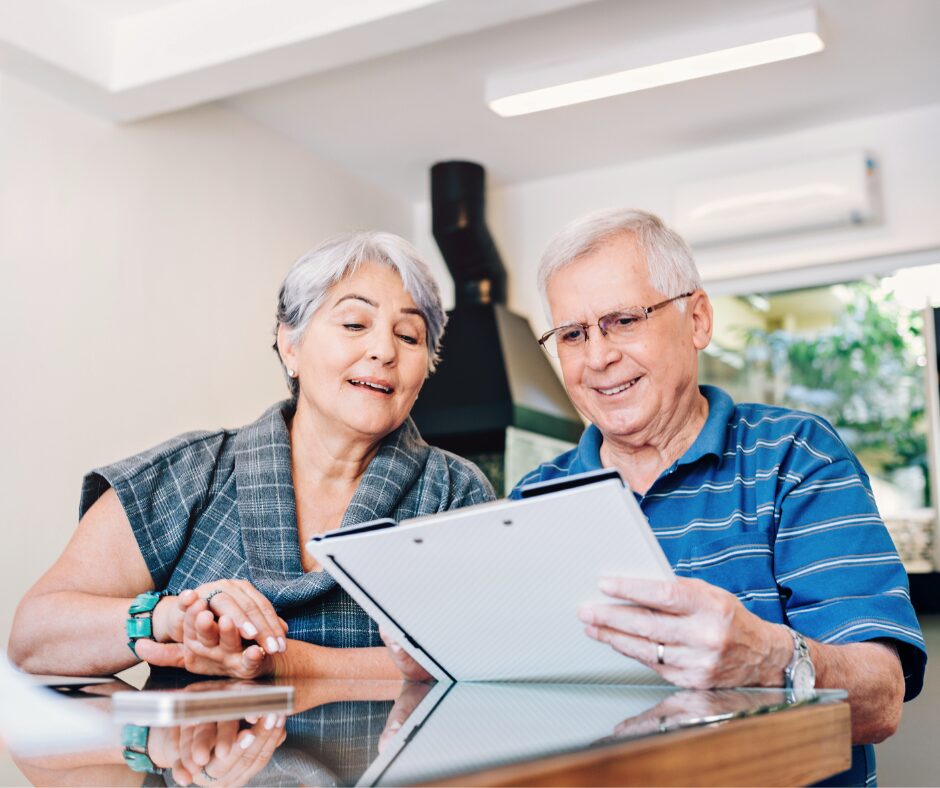 Older couple review paperwork together